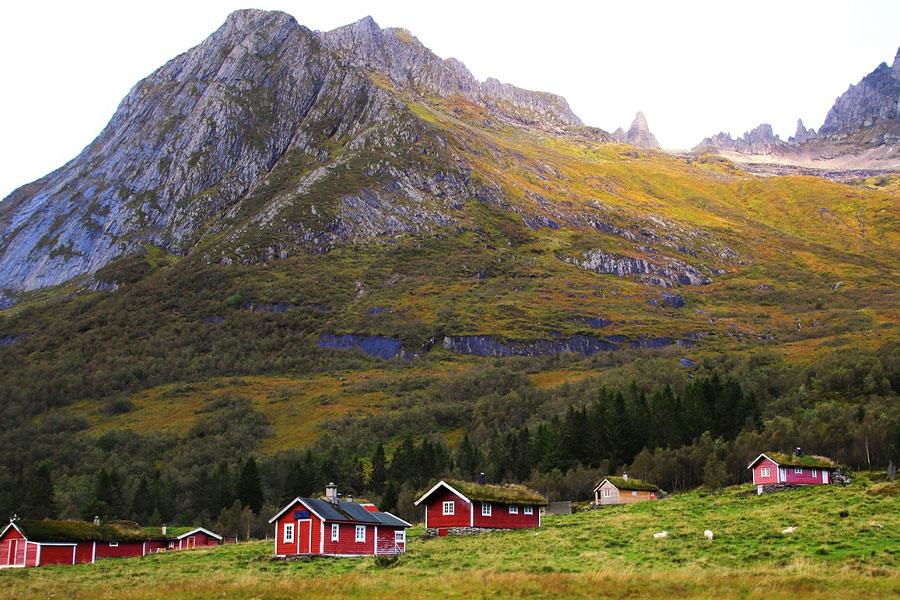 Red houses rocky mountain Norway