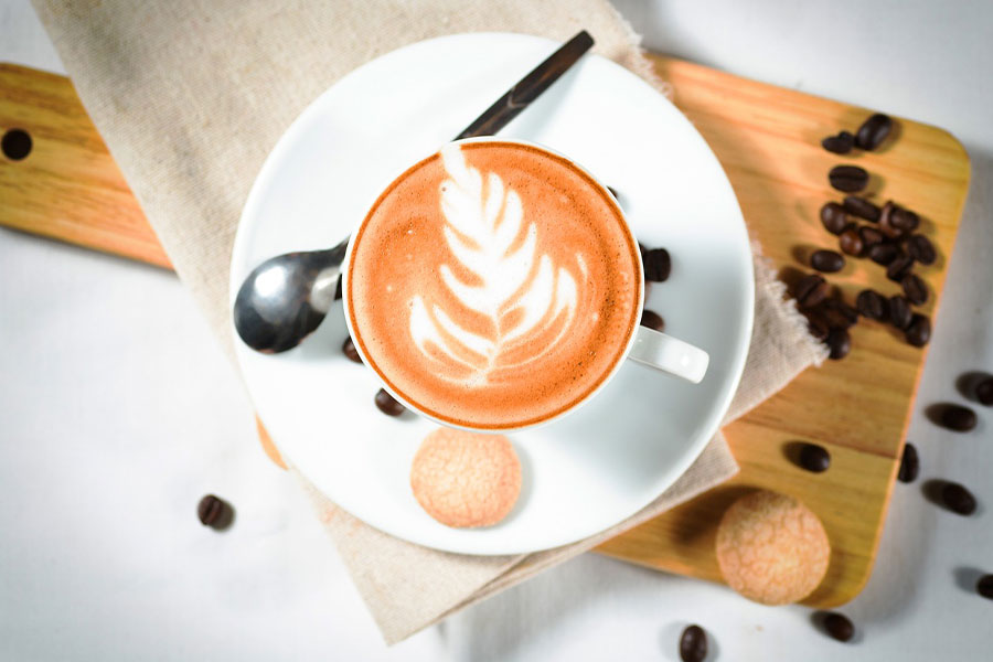 Leaf art cappucino coffee