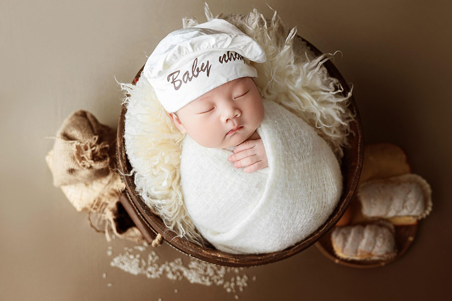 New born photography inside round thing